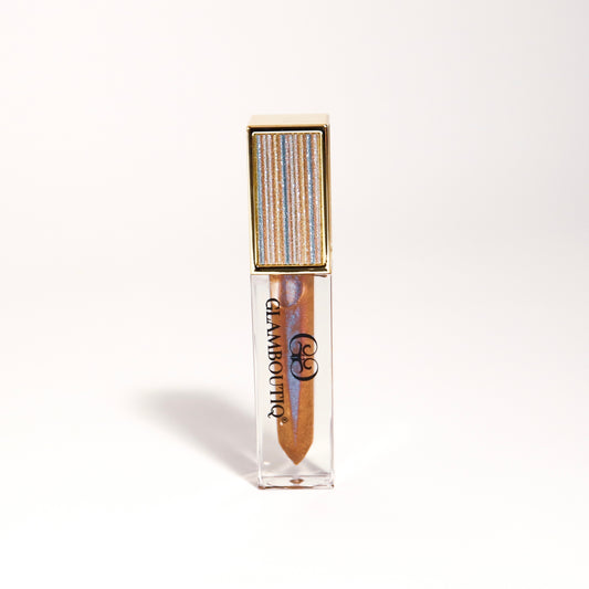 Lipgloss in a bold Doll Drama shade for a dramatic, high-shine finish